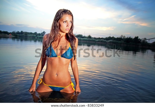 Sexy Girl In Bikini Posing At Sunset