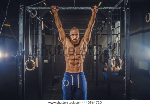 Shirtless Muscular Bearded Male Doing Exercises Stock Photo 440564710