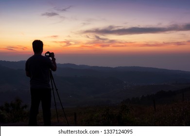 Silhouette Photographer Capture Sunset Stock Photo