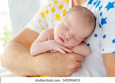 Strong Daddy Holding Naked Newborn Baby Stock Photo