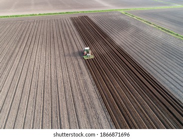 Tractor Cultivating Rows Before Potato Planting Stock Photo