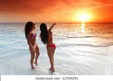 Two Beautiful Women Bikini Enjoying Sunset Stock Photo