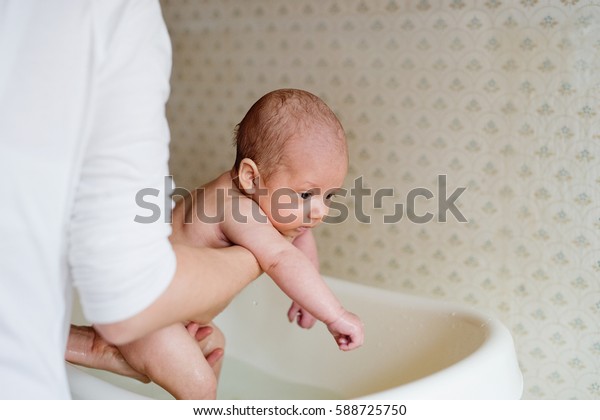 Unrecognizable Mother Bathing Her Son White Stock Photo