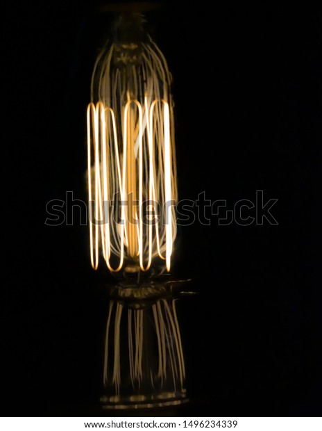 Vintage Lightbulb Reflection Blacked Out Background Stock Photo