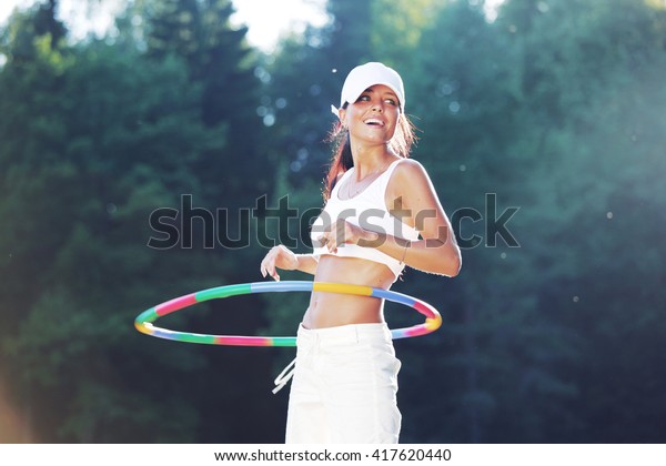 Woman Rotates Hula Hoop Outdoors Park Stock Photo Shutterstock