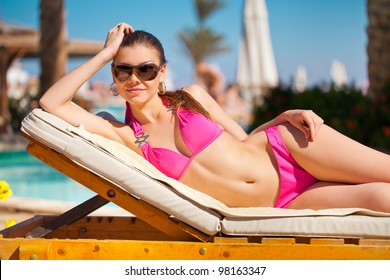 Woman Sunbathing Bikini Tropical Travel Resort Stock Photo