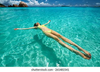 Woman Yellow Bikini Lying On Water Stock Photo 261481541 Shutterstock