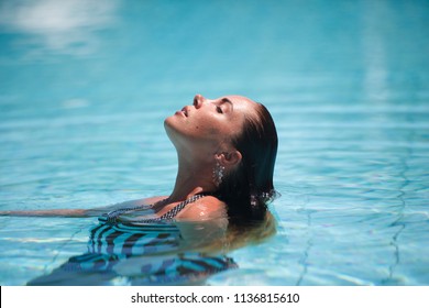 Women Stripped Swimsuite Sunbathing Pool Shutterstock