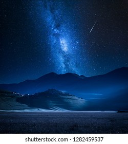 Arched Milky Way Over Beautiful Mountains Stock Photo