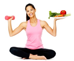 Portrait of a healthy woman with vegetables and dumbbells promoting a healthy fitness and eating lifestyle