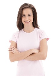 Confident college student girl smiling into camera with arms folded, isolated on white.