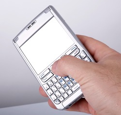 Man hand with a smartphone with blank display. Put your image there.