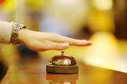 business woman at the reception of a hotel checking in
