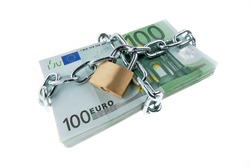 euro bank notes with a lock and chain. pile of money for security and investment.