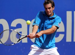 BARCELONA - APRIL, 26: Spanish tennis player Albert Ramos in action during his match against Kei Nishikori of Barcelona tennis tournament Conde de Godo on April 26, 2012 in Barcelona