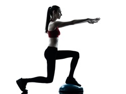 one caucasian woman exercising bosu balance ball trainer in silhouette studio isolated isolated on white background