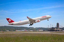 ZURICH - MAY 24: A-330 leaving Zurich airport for intercontinental flight on May 24, 2010 in Zurich, Switzerland. Zurich airport is home port for Swiss Air and one of the biggest european hubs.