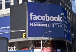 NEW YORK - MAY 18: Sign announcing Facebook IPO is flashed on a screen outside the Thomson Reuters building at the opening bell in Times Square on May 18, 2012 in New York City.