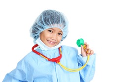 Young girl wearing a surgeons operating suit and holding a toy stethoscope.