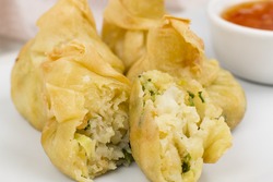 Shrimp Wonton - Close up of deep-fried fried prawn wontons with sweet chilli sauce. Close up.