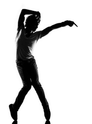 full length silhouette of a young man dancer dancing funky hip hop r&b on isolated studio white background