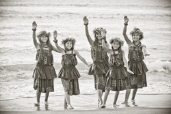 Hula girls on the beach in Black and white textured grain photo for aging effect