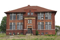 TALLMADGE, OH, JULY 3, 2012, Built in 1910 this stately school building served faithfully. Today, hard economic times find it patiently awaiting planned redevelopment. Tallmadge, Oh, July 3, 2012.