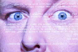 Computer screen reflection on a man's face showing stress or discomfort after a long period of work or study