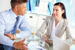 Successful business people talking about the terms of their business relationship