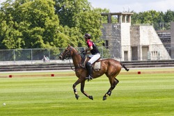 BERLIN- AUGUST 12- Unidentified Polo player in fast action at "Berlin Polo Cup" competition August 12, 2012 in Berlin, Germany.