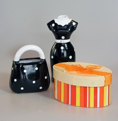 ladies shopping metaphors including brightly colored gift or pill box, dress and purse.
