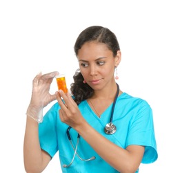 Female doctor, nurse looking at the container with some pills. isolated on white