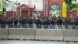 BANGKOK - MAY 31: Riot police form a line outside Thai Parliament during a political rally on May 31, 2012 in Bangkok, Thailand. Protesters rallied in opposition to a proposed reconciliation bill.