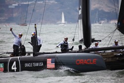 SAN FRANCISCO, CALIFORNIA, USA - AUGUST 25, 2012: American Team waves to the crowd in the America's Cup Sailing races for Louis Vuitton Cup on August 25, 2012 in San Francisco Bay, California