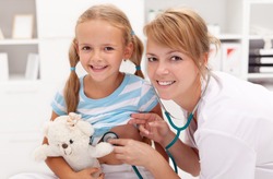 Little girl at the doctor's - pediatric checkup