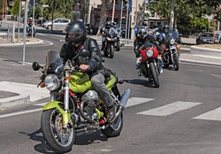 SAN VITTORE, FC, ITALY - JULY 15: unidentified biker riding a italian motorcycle Moto Guzzi V11 Sport at rally "VIII weekend Moto Guzzi" on July 15, 2012 in San Vittore (FC) Italy