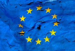 European Union flag with the texture of old and cracked wall.
A conceptual image of the European crisis.