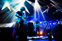 SEATTLE - SEPTEMBER 3, 2012: French electronic pop band M83 performs on the main stage at Key Arena during the Bumbershoot music festival in Seattle on September 3, 2012.