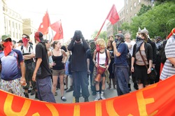 TORONTO-JUNE 26: Masked protesters who were later alleged of vandalizing during the G20 Protest on June 26 2010 in Toronto, Canada.