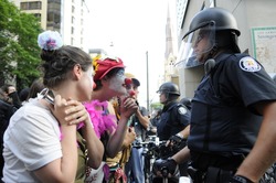 TORONTO-JUNE 25: Protesters dressed as clowns making fun of the police officers during the G20 Protest on June 25 2010 in Toronto, Canada.