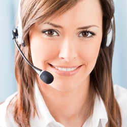 Portrait of happy smiling cheerful support phone operator in headset at office
