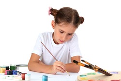 Cute little girl painting a picture, isolated on white