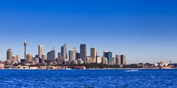Sydney city CBD cityscape cityline panoramic view from sydney harbour sunny day water and blue sky - major australia landmarks