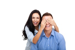 portrait of a happy young female surprise husband cover his eyes, pretty woman covering mans eyes, couple love excited smile, isolated over white background