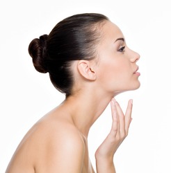 Beautiful woman cares for the skin neck- posing at studio isolated on white