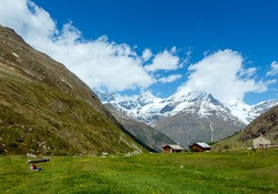 Family (mother with children) walk on summer Alps mountain plateau (Switzerland, near Zermatt)