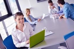 business woman with her staff, people group in background at modern bright office indoors