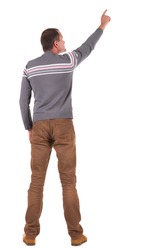 Back view of pointing young men in sweater and jeans. Young guy gesture. Rear view people collection. backside view of person. Isolated over white background.