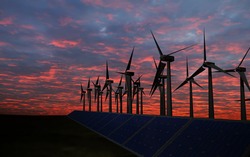 business man push power button, Panels with solar cells and wind generators on a green field with blue sky