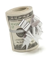 Roll of One Hundred Dollar Bills Tied in a Silver Bow on a White Background.